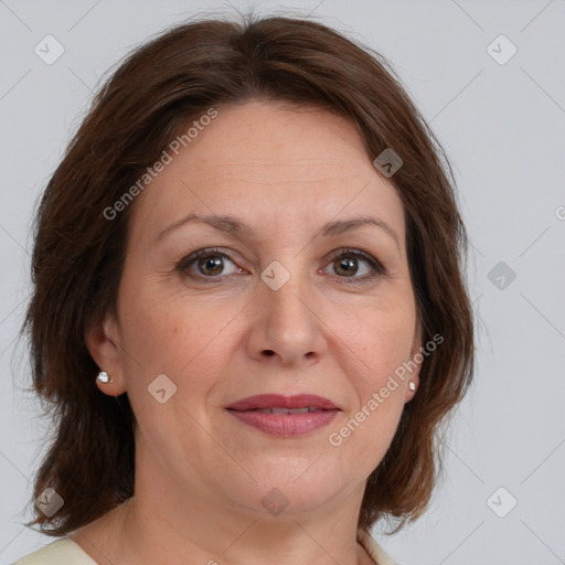 Joyful white adult female with medium  brown hair and brown eyes