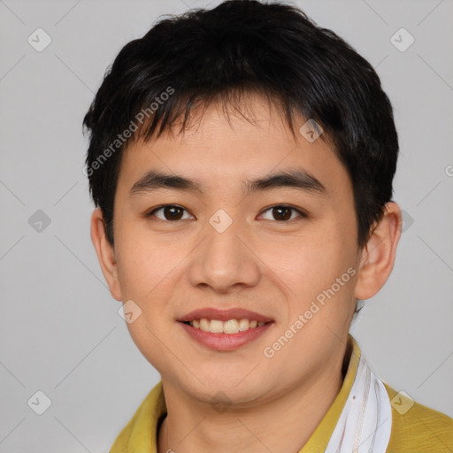 Joyful asian young-adult male with short  brown hair and brown eyes