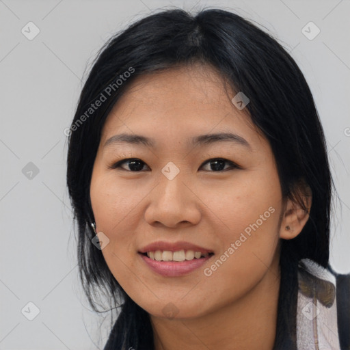 Joyful asian young-adult female with medium  black hair and brown eyes