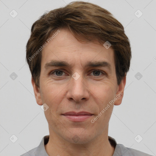 Joyful white adult male with short  brown hair and grey eyes