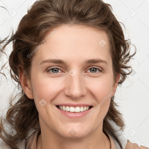 Joyful white young-adult female with medium  brown hair and blue eyes