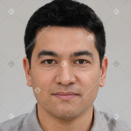 Joyful white young-adult male with short  black hair and brown eyes