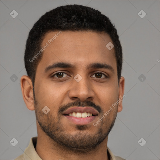 Joyful latino young-adult male with short  brown hair and brown eyes