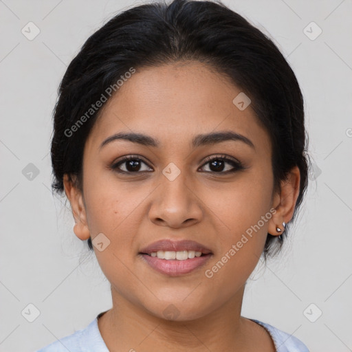 Joyful latino young-adult female with medium  brown hair and brown eyes