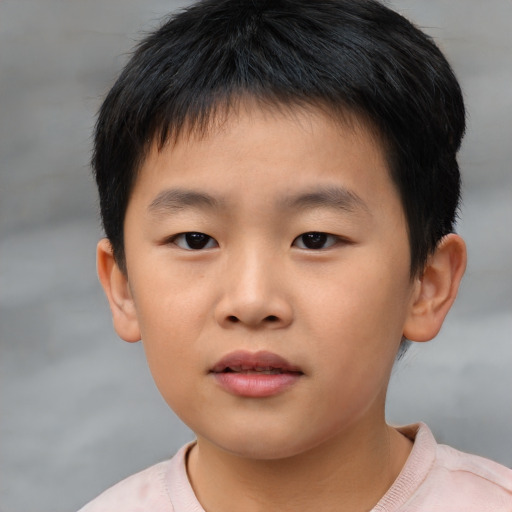 Neutral asian child male with short  brown hair and brown eyes