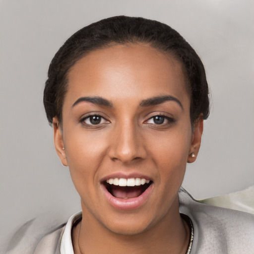 Joyful white young-adult female with short  black hair and brown eyes