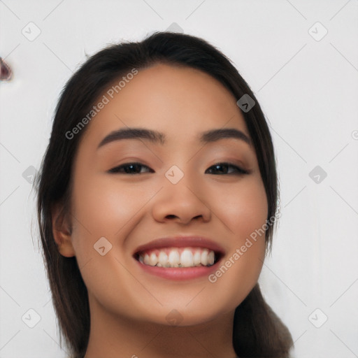 Joyful latino young-adult female with long  black hair and brown eyes