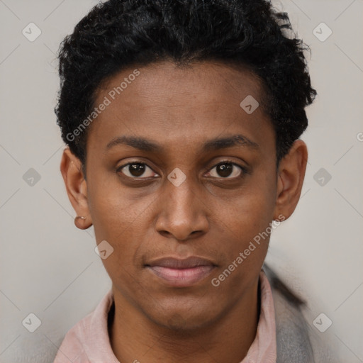 Joyful black young-adult female with short  black hair and brown eyes