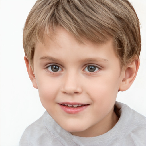 Joyful white child male with short  brown hair and grey eyes