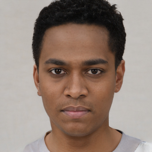 Neutral black young-adult male with short  black hair and brown eyes