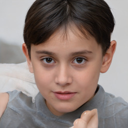 Joyful white child female with short  brown hair and brown eyes