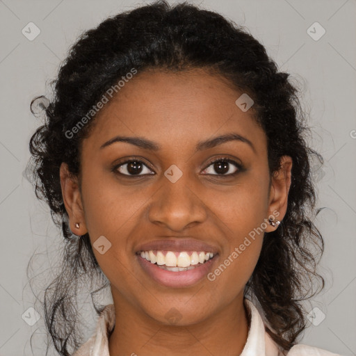 Joyful black young-adult female with long  brown hair and brown eyes