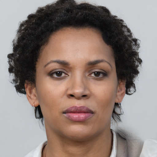 Neutral black adult female with short  brown hair and brown eyes