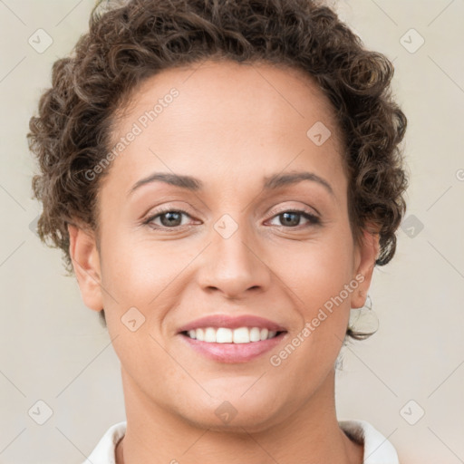 Joyful white young-adult female with short  brown hair and brown eyes