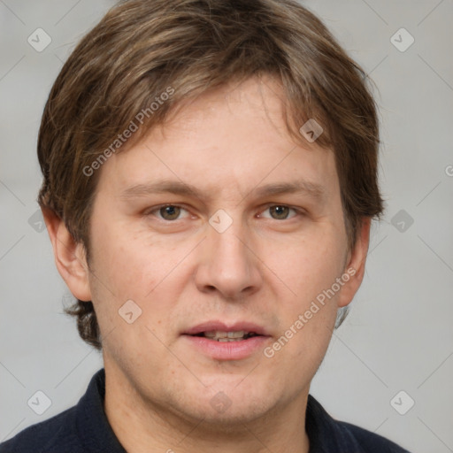 Joyful white adult male with short  brown hair and grey eyes