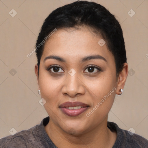 Joyful latino young-adult female with short  black hair and brown eyes