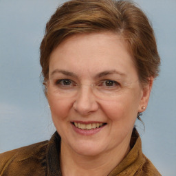 Joyful white adult female with medium  brown hair and brown eyes