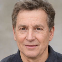 Joyful white middle-aged male with short  brown hair and brown eyes