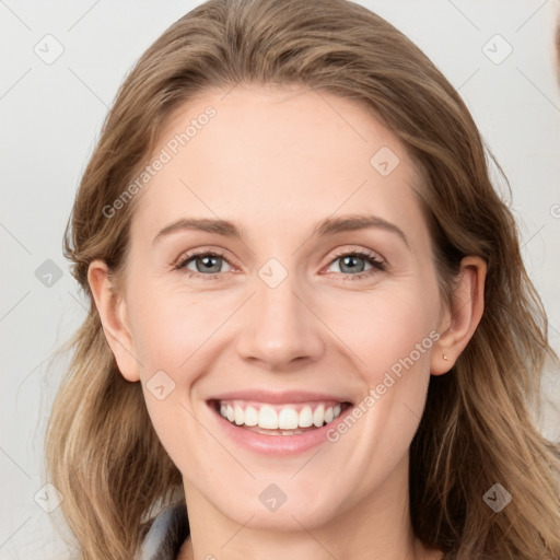 Joyful white young-adult female with medium  brown hair and blue eyes