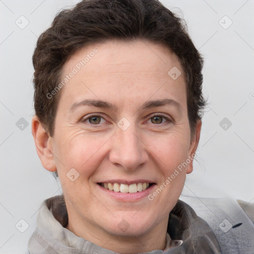 Joyful white adult female with short  brown hair and brown eyes