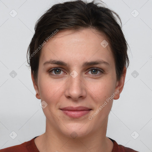 Joyful white young-adult female with short  brown hair and grey eyes