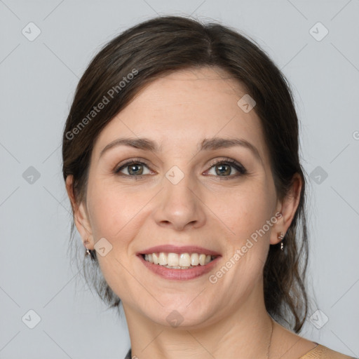 Joyful white young-adult female with medium  brown hair and grey eyes