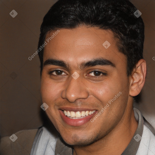 Joyful latino young-adult male with short  brown hair and brown eyes