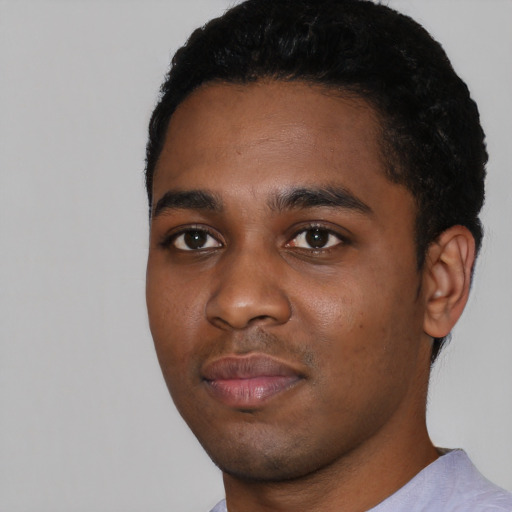 Neutral black young-adult male with short  black hair and brown eyes