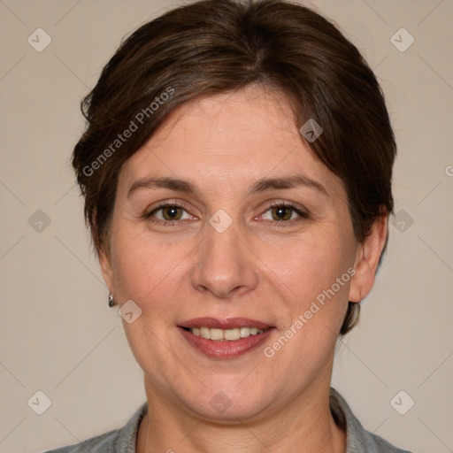 Joyful white adult female with short  brown hair and brown eyes