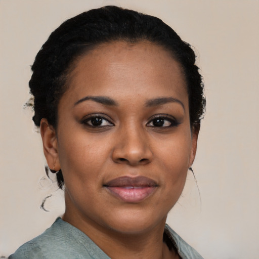 Joyful black young-adult female with medium  black hair and brown eyes