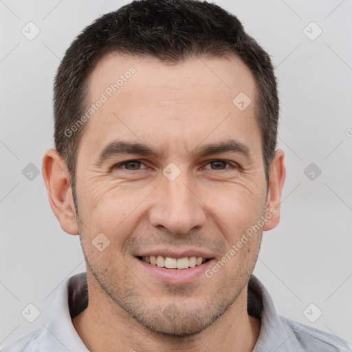 Joyful white adult male with short  brown hair and brown eyes