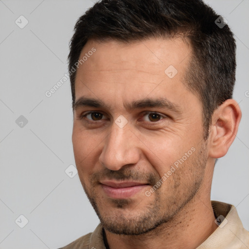 Joyful white adult male with short  brown hair and brown eyes