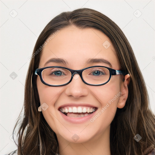 Joyful white young-adult female with long  brown hair and blue eyes