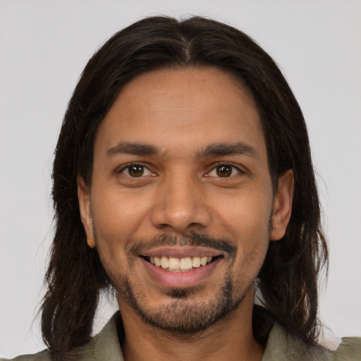 Joyful white young-adult male with medium  brown hair and brown eyes