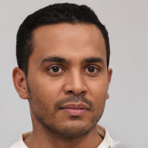 Neutral latino young-adult male with short  brown hair and brown eyes
