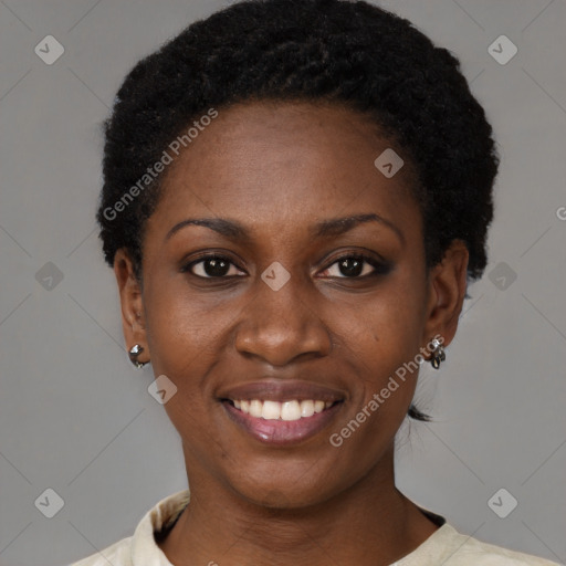 Joyful black young-adult female with short  black hair and brown eyes