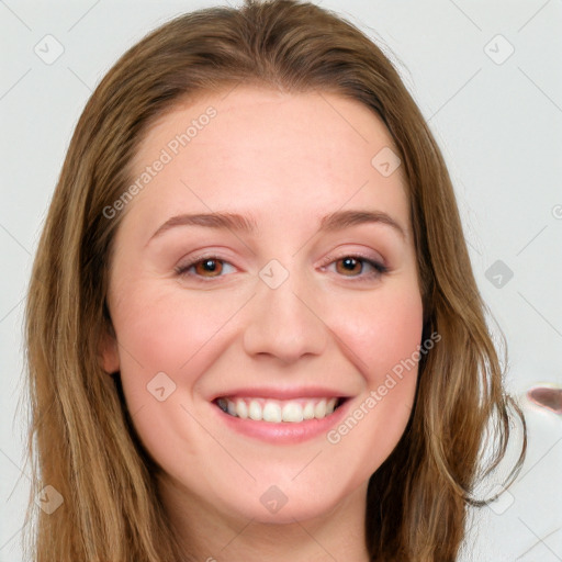 Joyful white young-adult female with long  brown hair and blue eyes