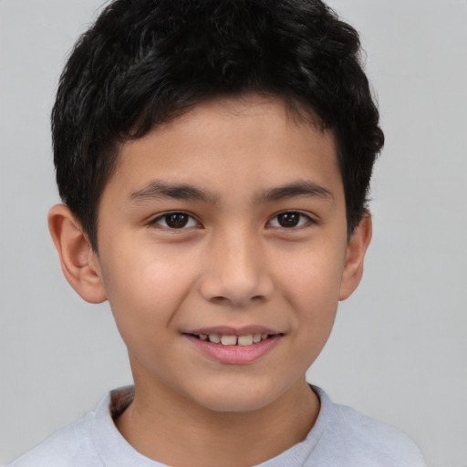 Joyful asian child male with short  brown hair and brown eyes