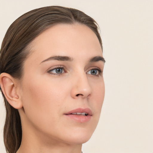 Neutral white young-adult female with long  brown hair and brown eyes