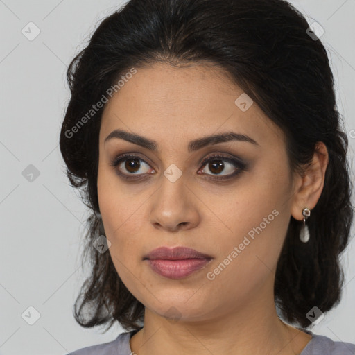 Joyful latino young-adult female with medium  brown hair and brown eyes