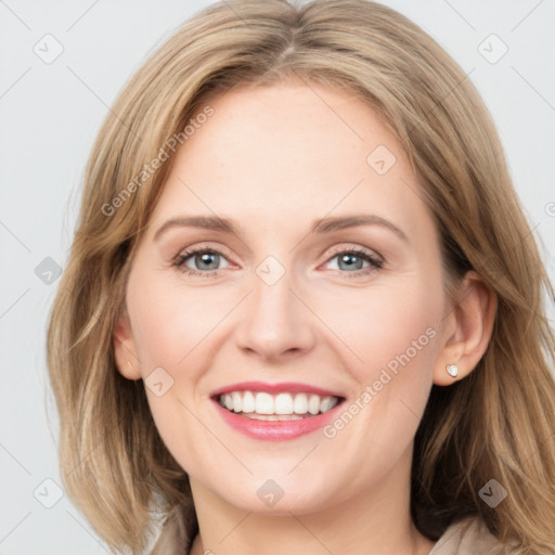 Joyful white young-adult female with medium  brown hair and blue eyes