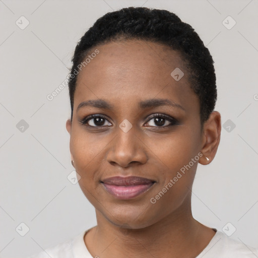 Joyful black young-adult female with short  black hair and brown eyes