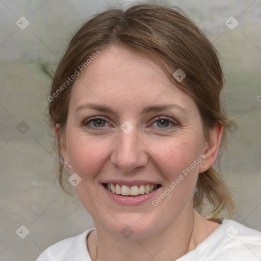 Joyful white young-adult female with medium  brown hair and blue eyes