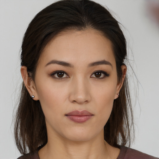 Neutral white young-adult female with medium  brown hair and brown eyes