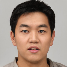 Neutral asian young-adult male with short  black hair and brown eyes