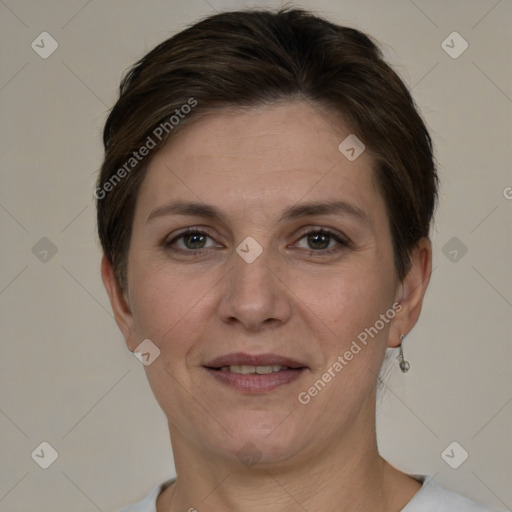 Joyful white adult female with short  brown hair and grey eyes