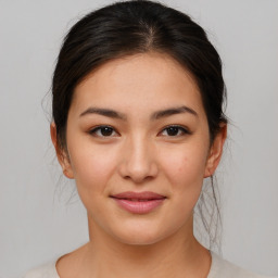 Joyful asian young-adult female with medium  brown hair and brown eyes