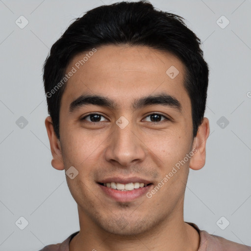 Joyful white young-adult male with short  black hair and brown eyes