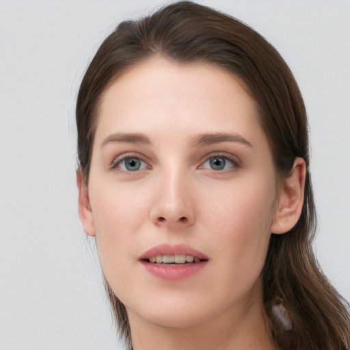 Joyful white young-adult female with long  brown hair and grey eyes