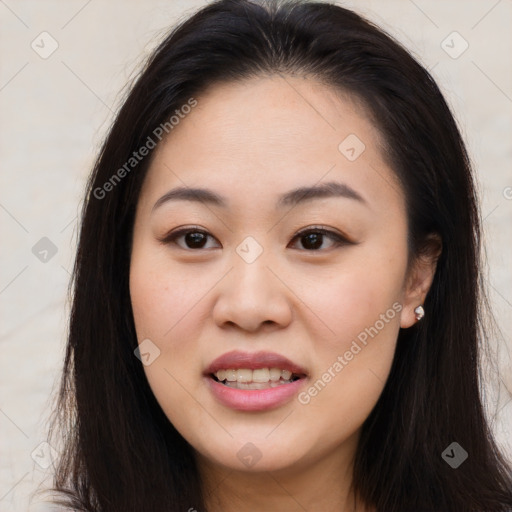 Joyful asian young-adult female with long  brown hair and brown eyes